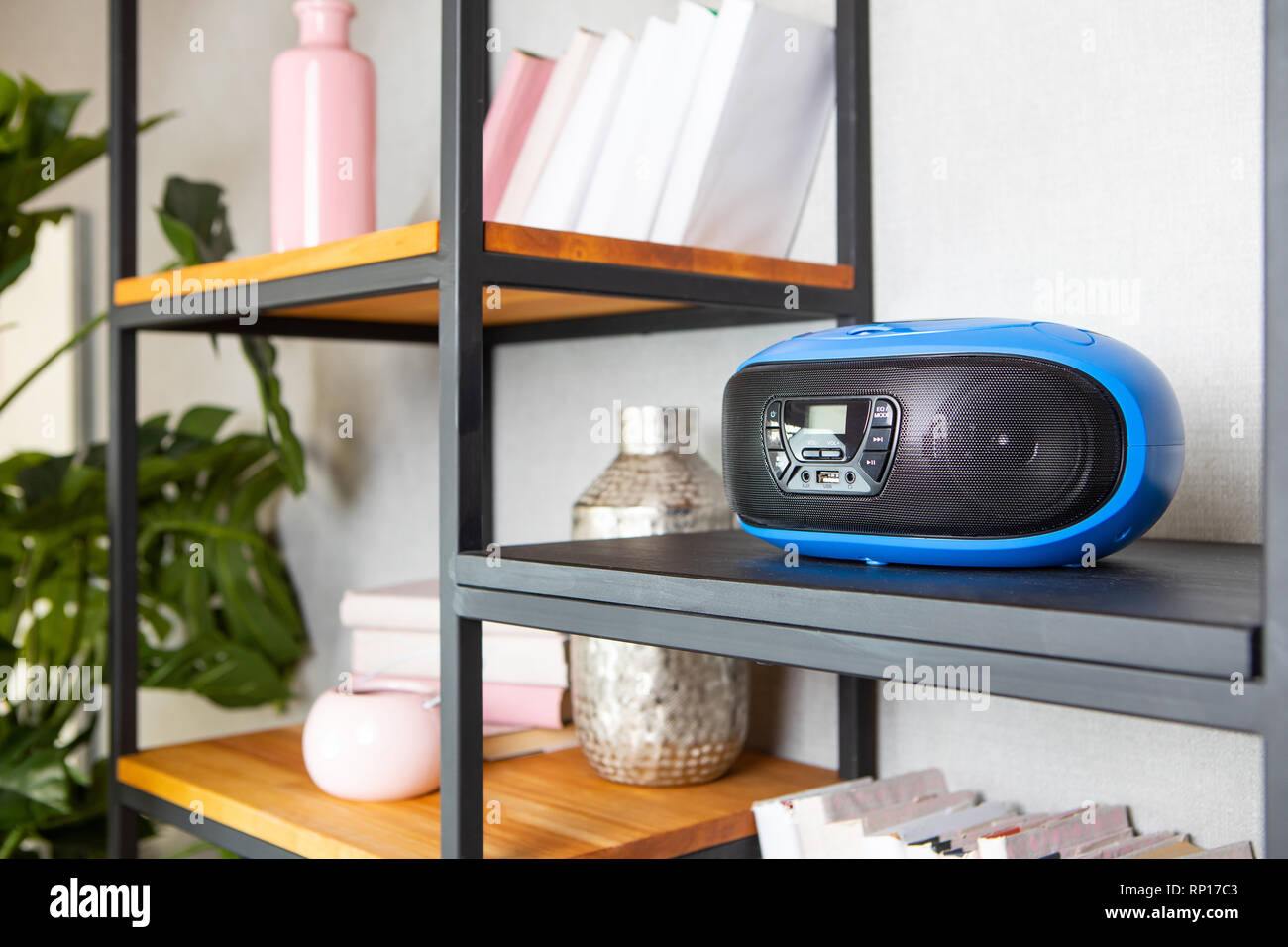 Compact CD radio player on the shelf in vintage interior Stock Photo
