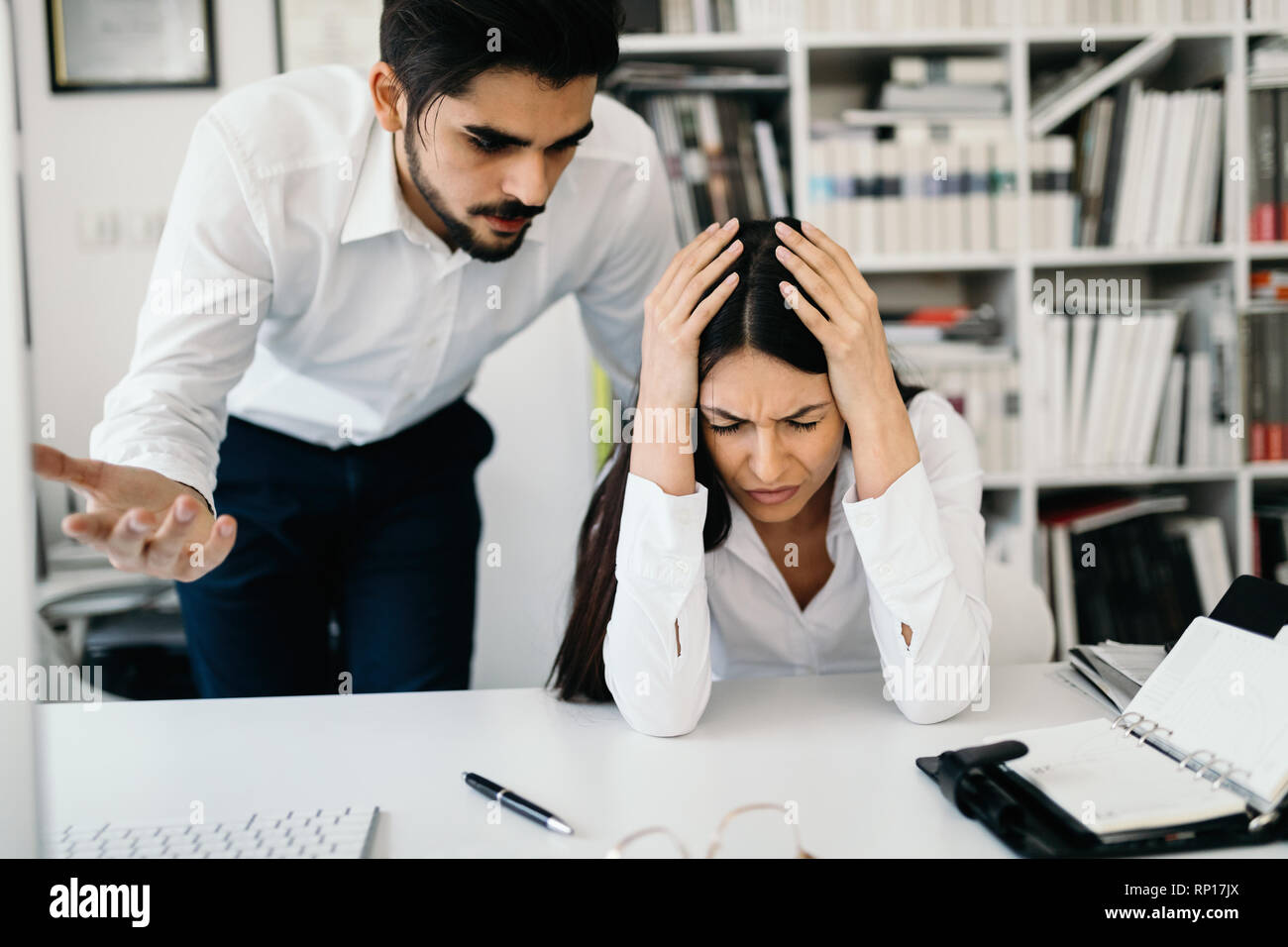 Angry boss yelling at his employee in office Stock Photo Alamy