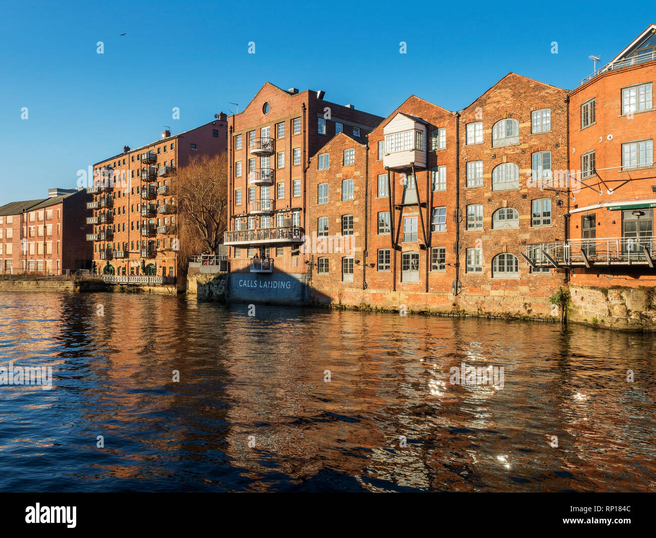 Converted riverside buildings at Calls Landing on the River Aire in Leeds West Yorkshire England Stock Photo