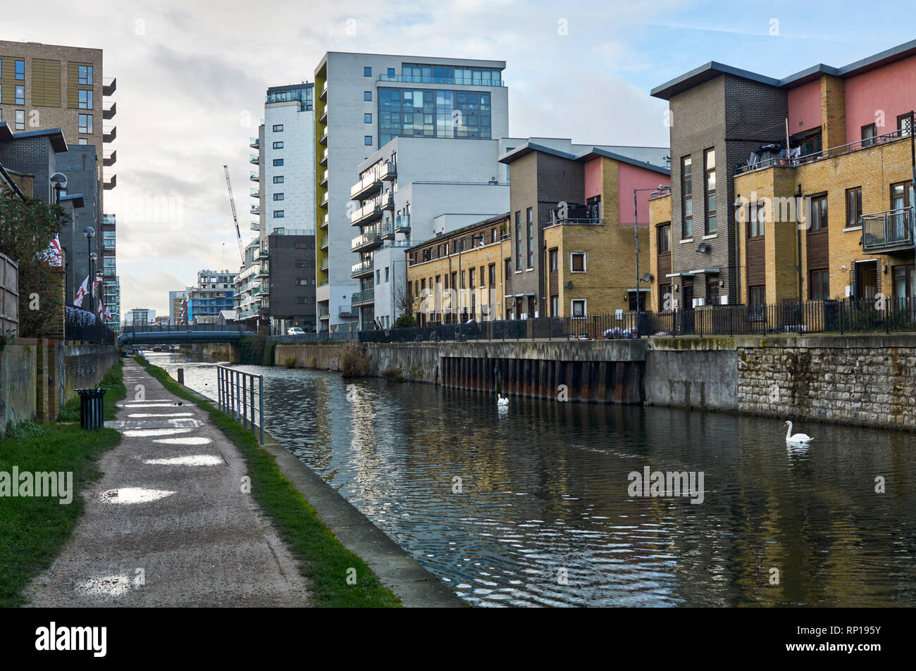 New apartments and housing along Limehouse Cut, near Limehouse, in London's East End, UK Stock Photo