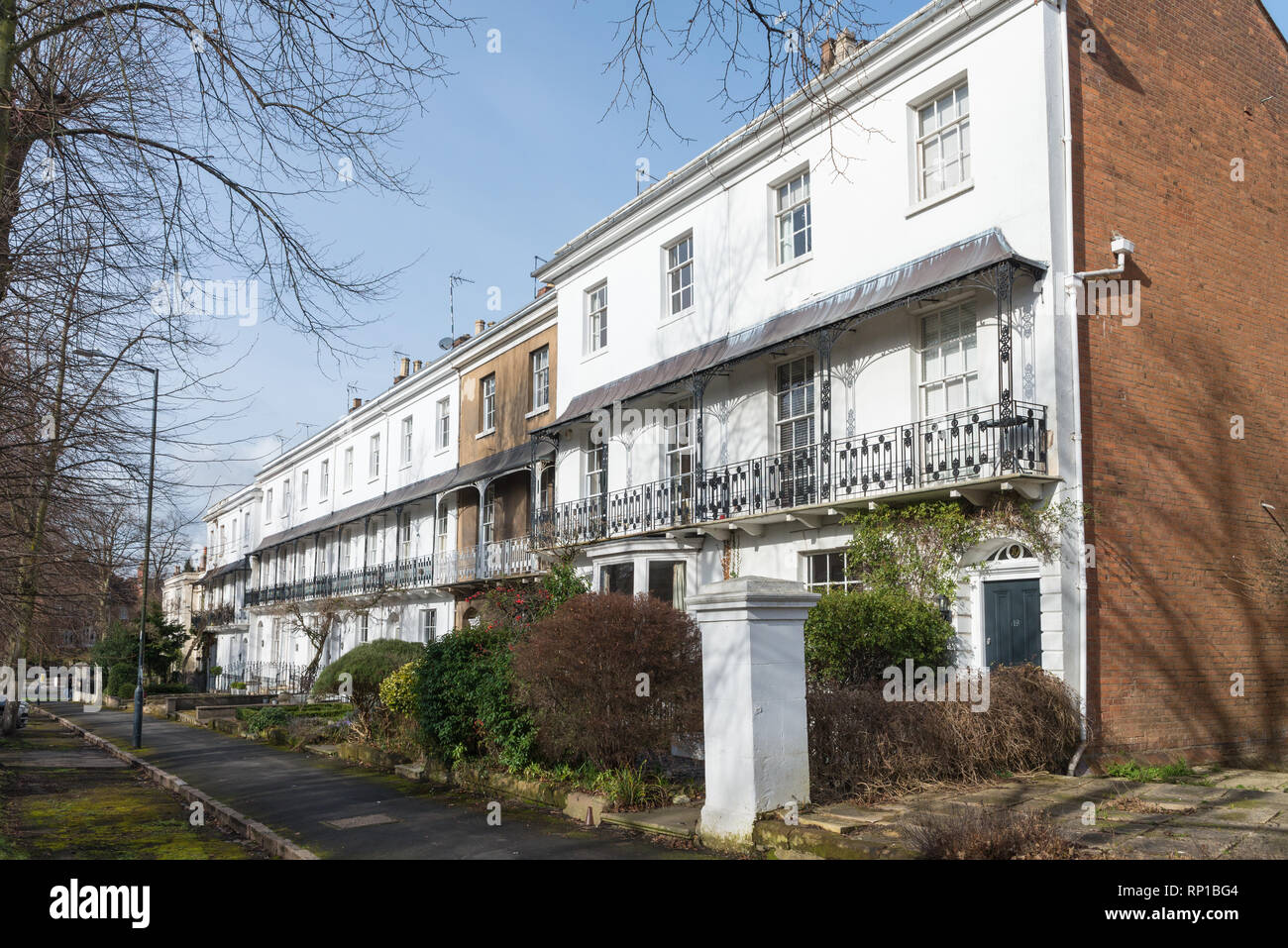 Row of smart white Regency villas or houses in Binswood Avenue, Leamington Spa, Warwickshire Stock Photo