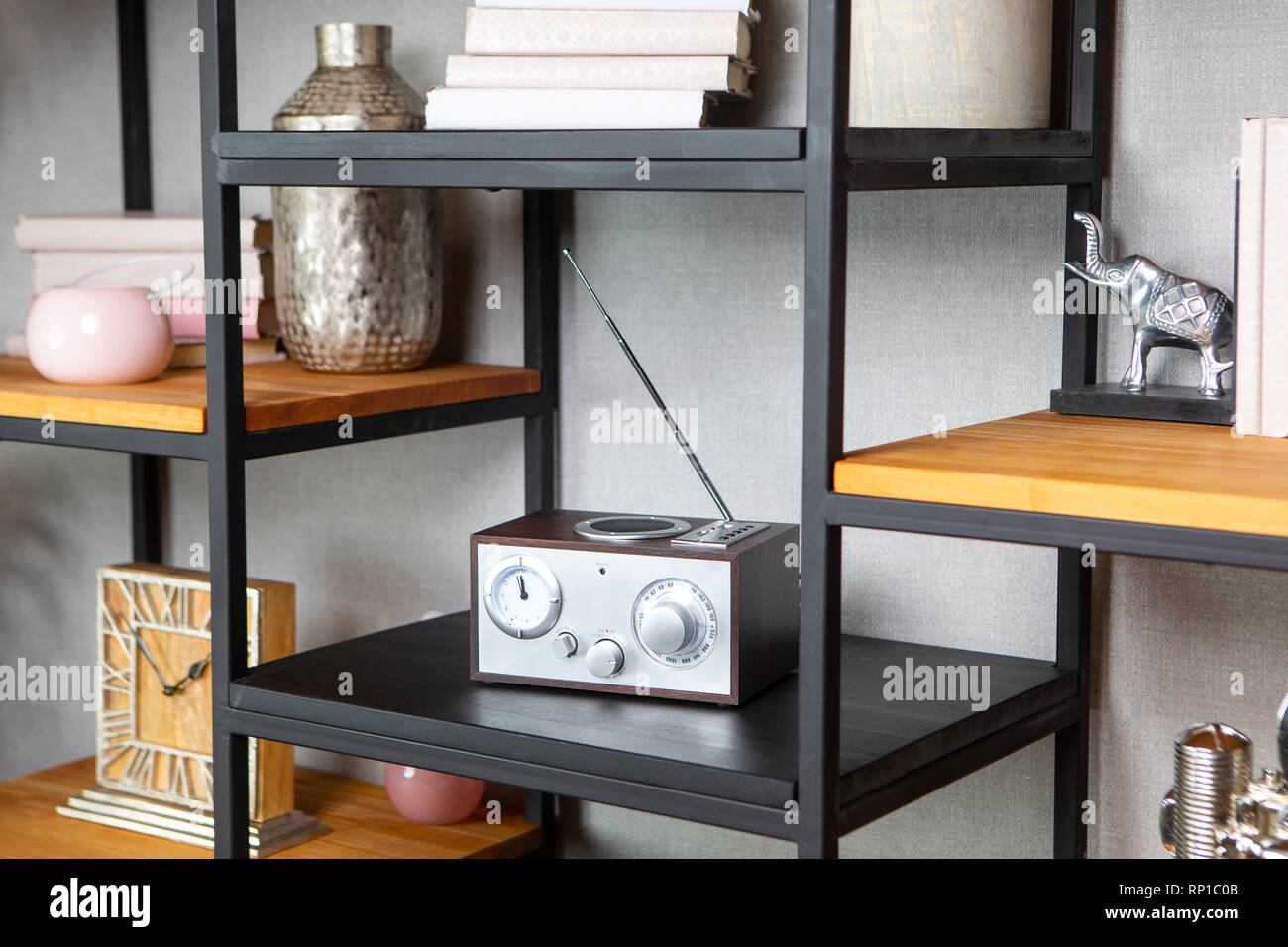Compact radio on the shelf in the vintage interior of the living room Stock Photo