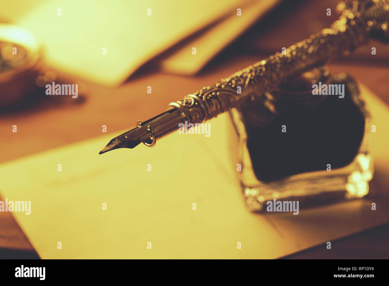 writing message with ancient quill pen Stock Photo