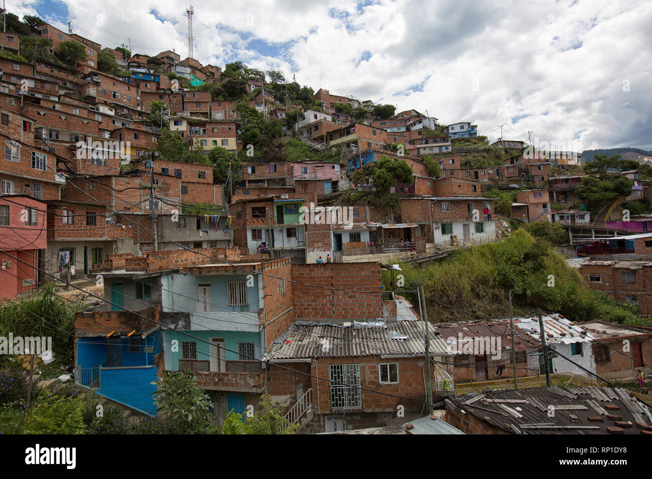 Medellin, Colombia - August 20, 2018: houses built on moiuntin side in the famous 13 district of the city Stock Photo