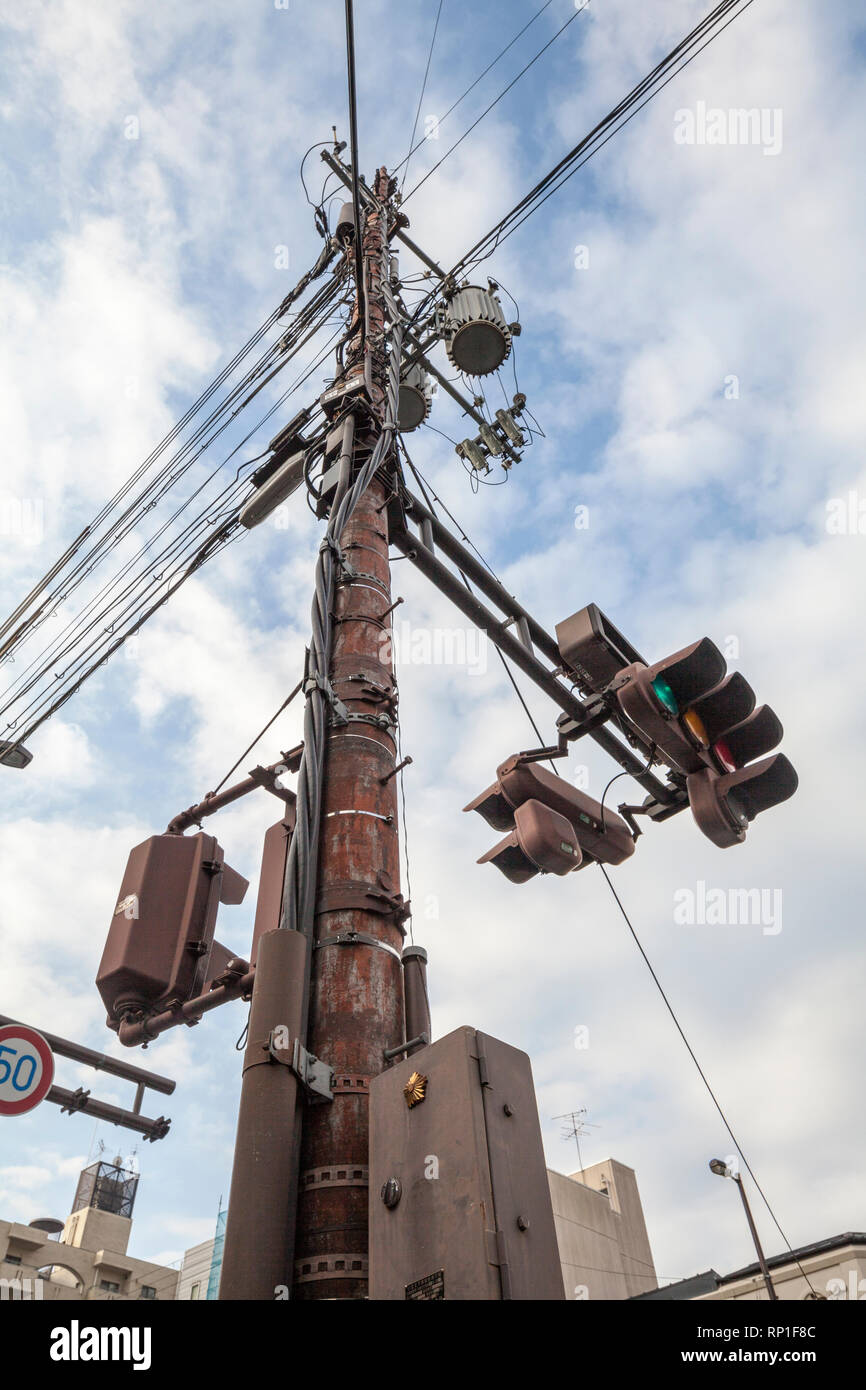 A telegraph and utility pole fitted with traffic lights in Kyoto, Japan  Stock Photo - Alamy