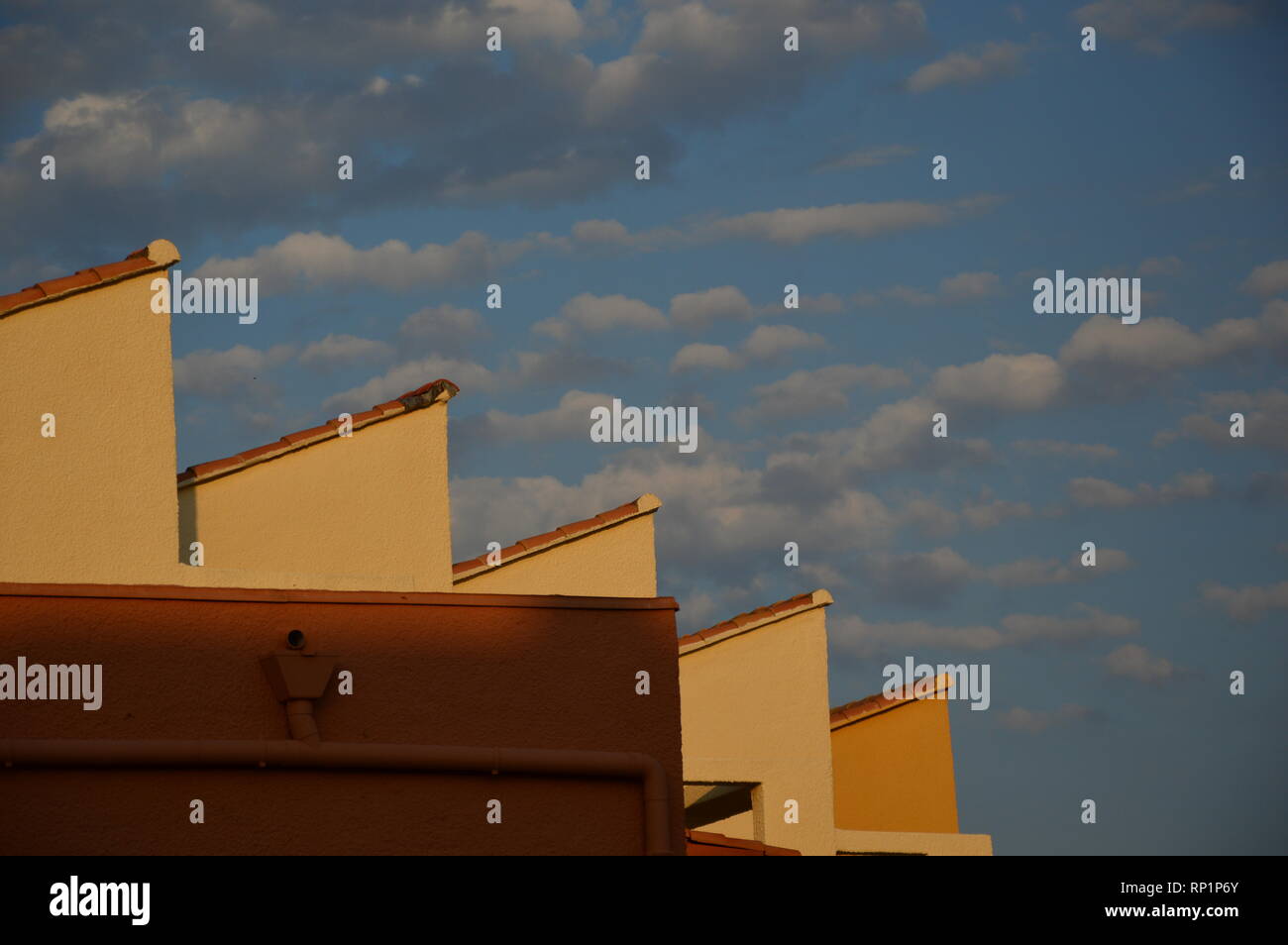 Roofs in the sky with cloudy and blue sky background Stock Photo - Alamy