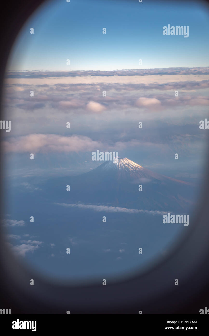 View form airplane window. Mount Fuji ( Mt. Fuji ) with blue sky and cloud in background. Tokyo, Japan Stock Photo