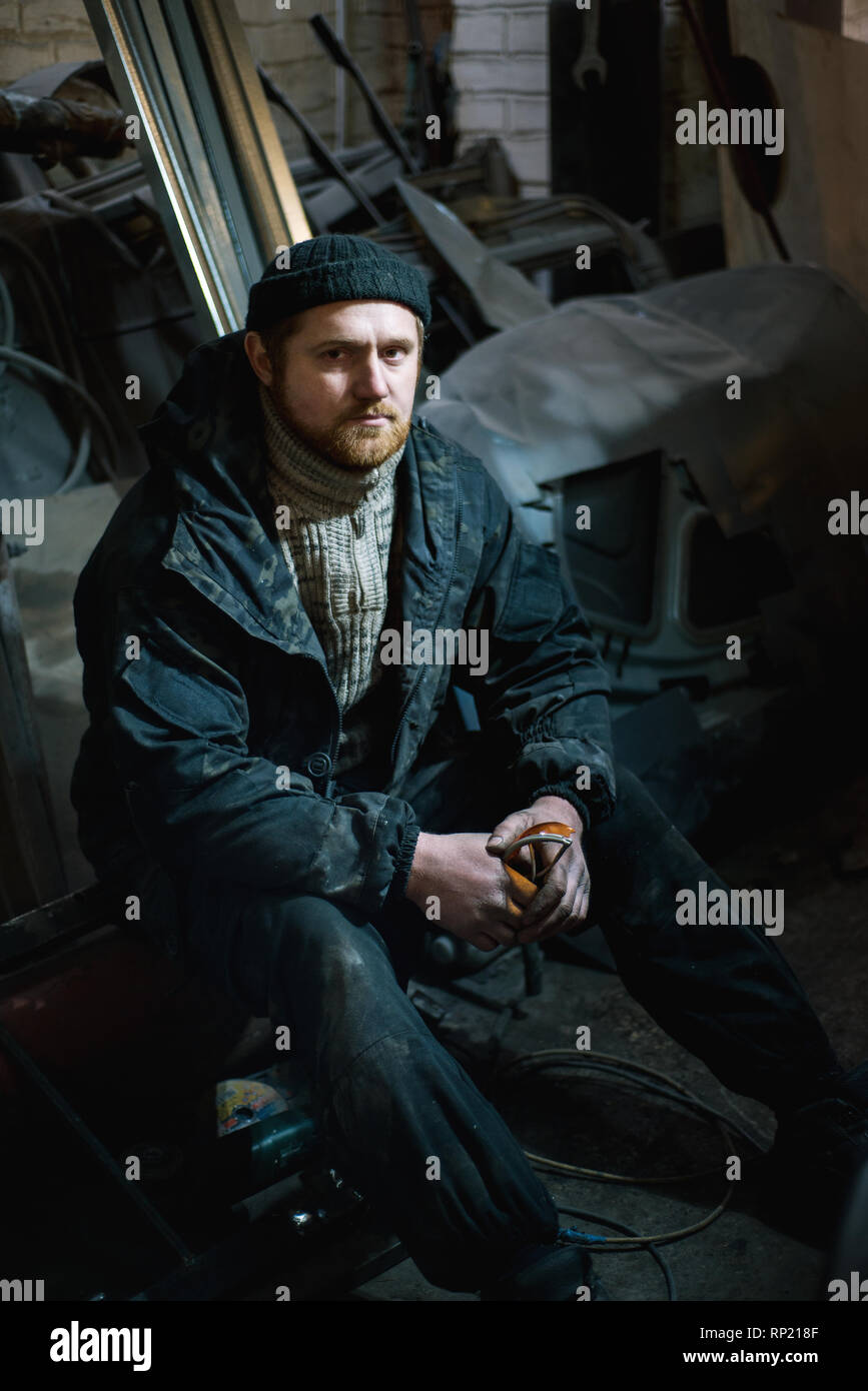 Portrait of a man in a factory at work Stock Photo - Alamy