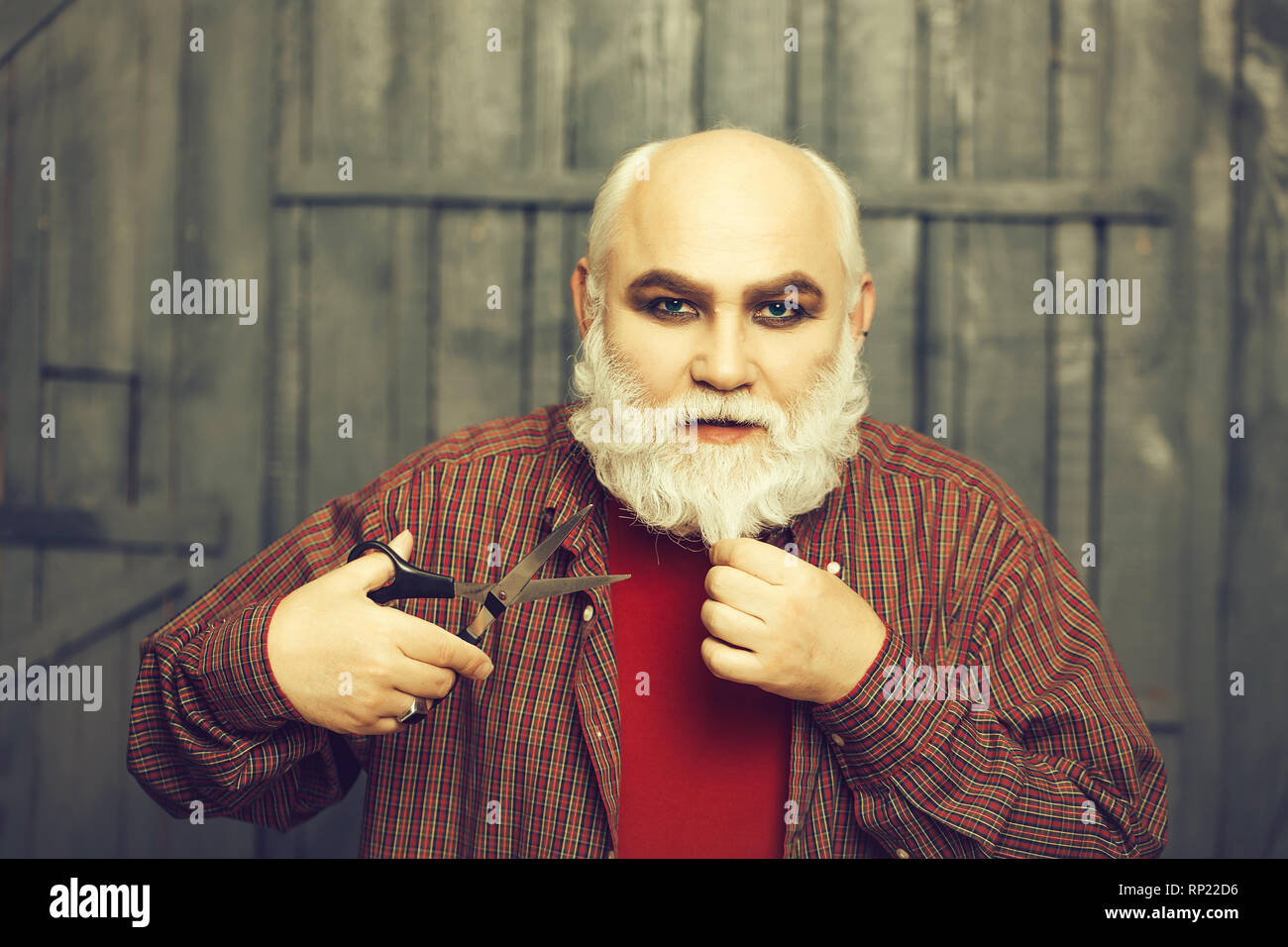 old man cutting beard with scissors Stock Photo Alamy