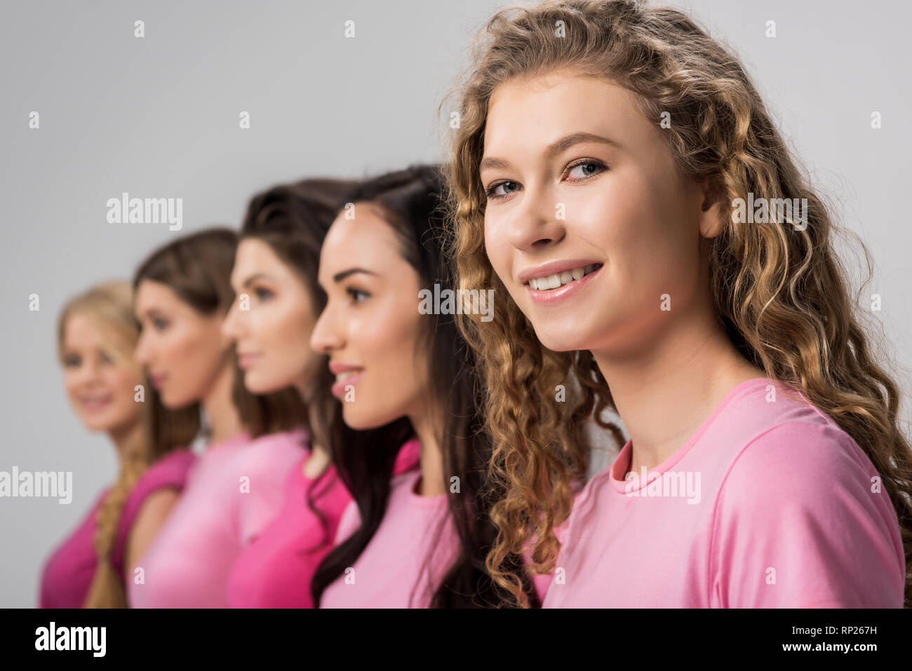 Selective Focus Of Happy Girl With Curly Hair Near Young