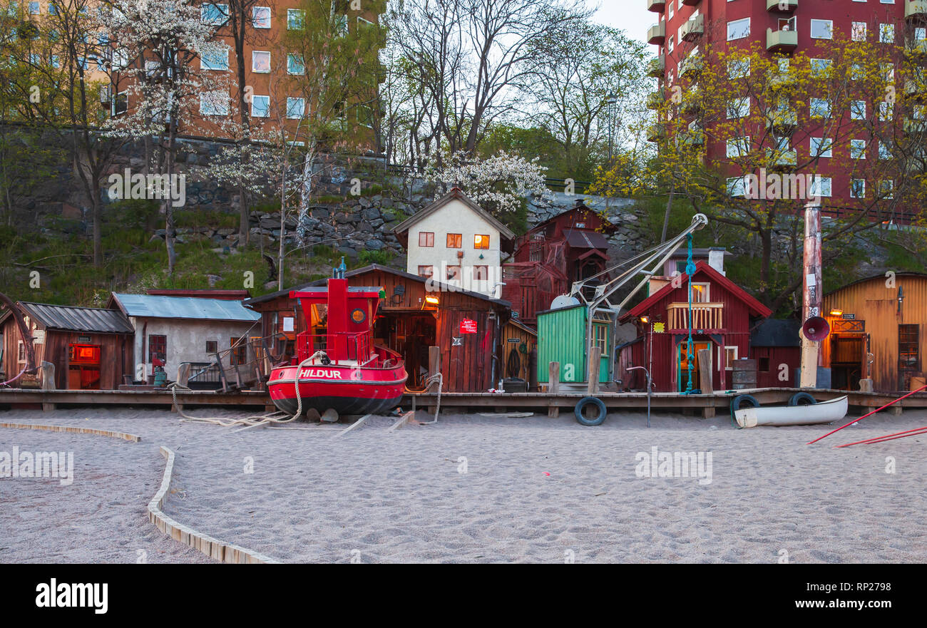 Stockholm, Sweden - May 5, 2016: Old village stylized playground with traditional Swedish red barns Stock Photo