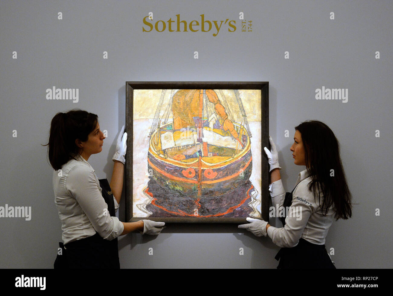 Gallery assistants adjust Triestiner Fischerboot by Egon Schiele during