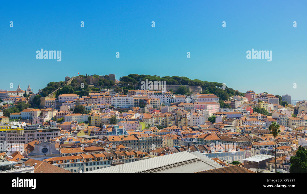 panoramic view over the center of Lisbon from the viewpoint called: Miradouro de Sao Pedro de Alcantara featuring the Baixa neighbourhood and Castelo  Stock Photo
