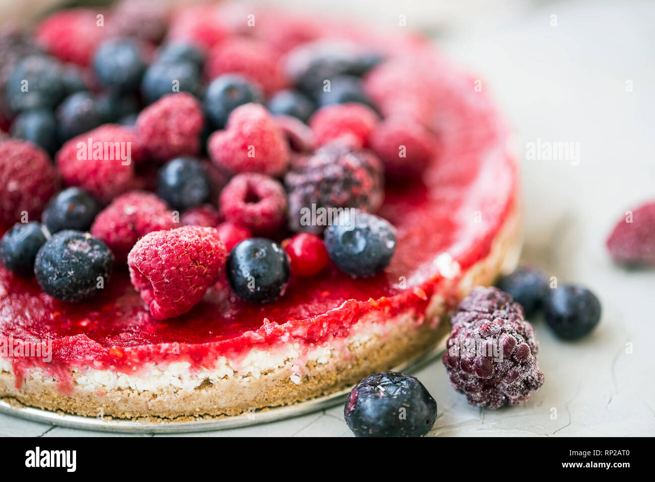 Raw cake with berries, raw vegan dessert with fresh berries closeup Stock Photo