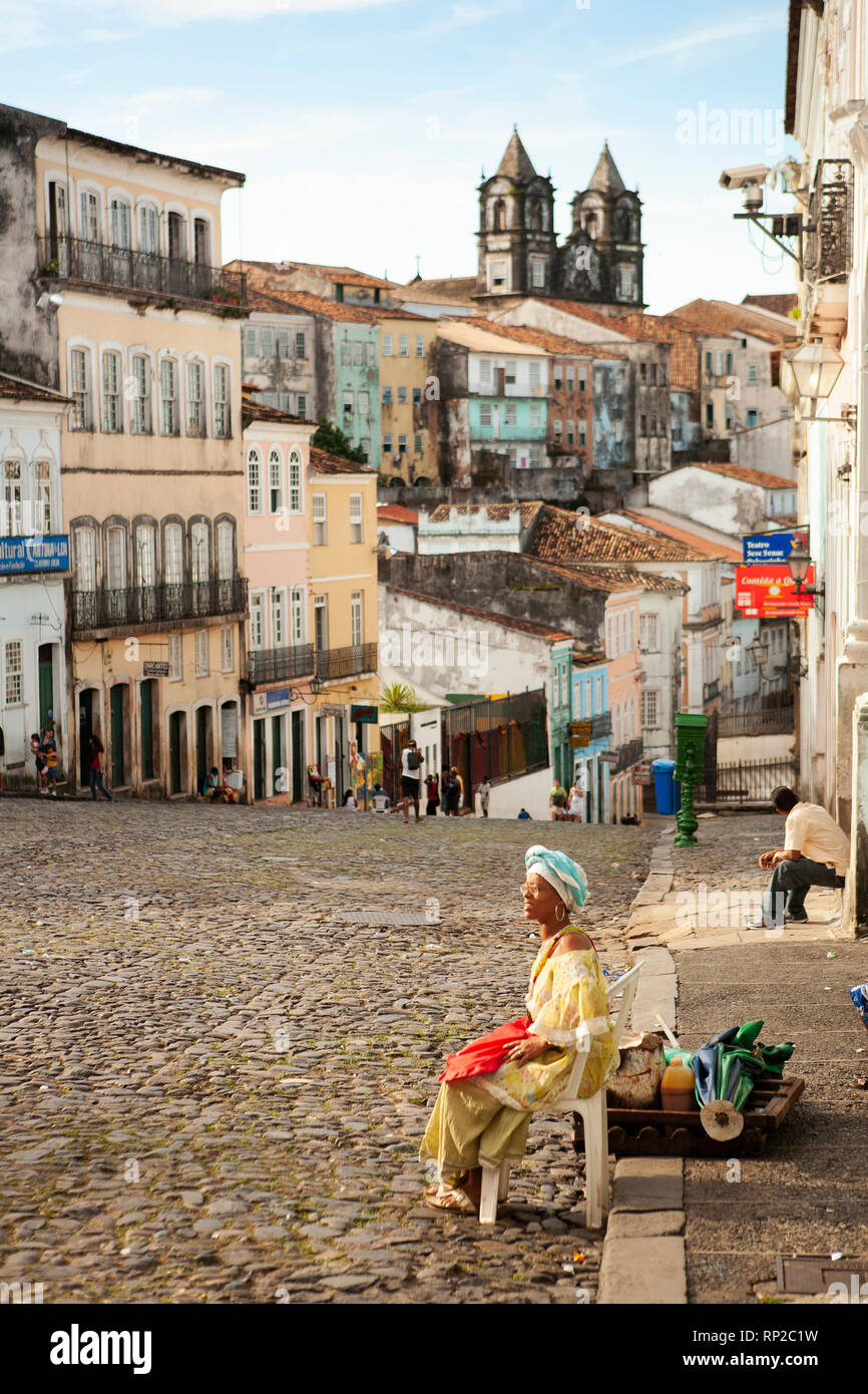 A local Baiana woman in traditional dress in the historic center of Salvador, Bahia, Brazil Stock Photo