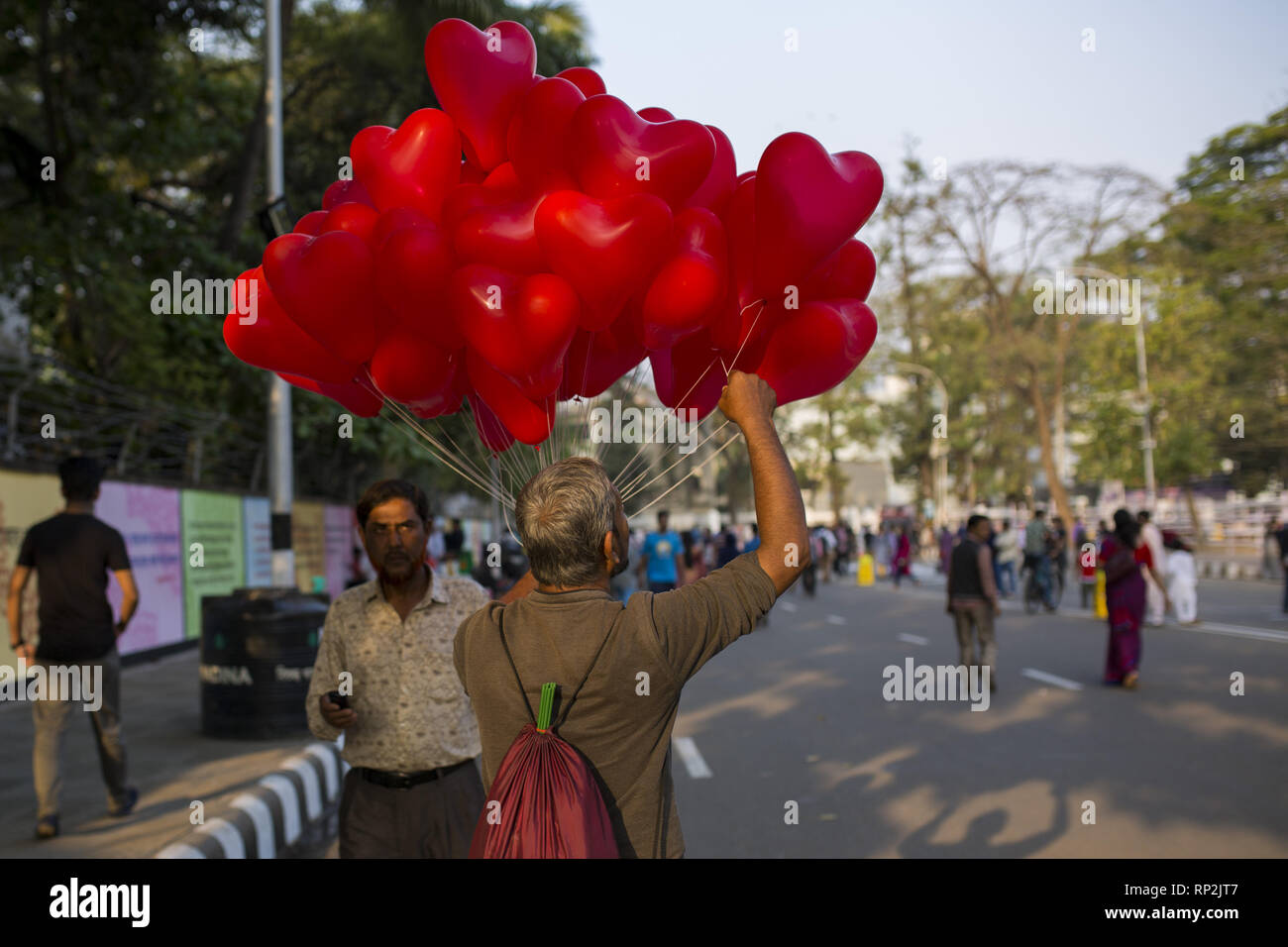 Dhaka, Bangladesh. 20th Feb, 2019. FEBRUARY 20 : A hawker sells red balloon in front of the language matyrs monument in Dhaka, Bangladesh on February 20, 2019.The nation will pay tribute to the Bangla language movement martyrs who sacrificed their life for their mother tongue in 1952, while the United Nations Educational Scientific and Cultural Organization (UNESCO) declared 21 February as the International Mother Language Day. Credit: Zakir Hossain Chowdhury/ZUMA Wire/Alamy Live News Stock Photo