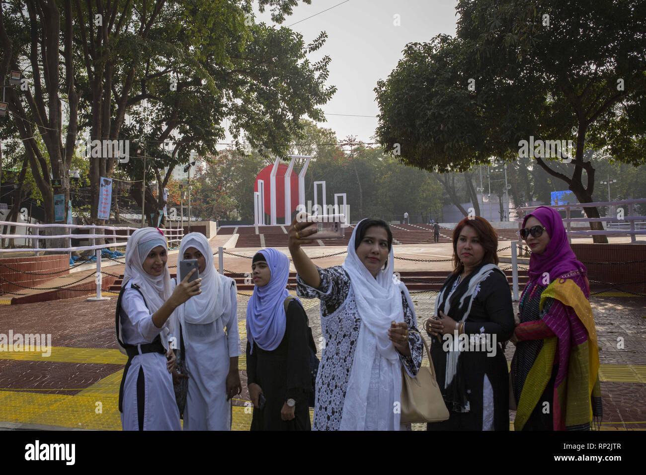 Dhaka, Bangladesh. 20th Feb, 2019. FEBRUARY 20 : Bangladeshi people take selfie in front of the language matyrs monument in Dhaka, Bangladesh on February 20, 2019.The nation will pay tribute to the Bangla language movement martyrs who sacrificed their life for their mother tongue in 1952, while the United Nations Educational Scientific and Cultural Organization (UNESCO) declared 21 February as the International Mother Language Day. Credit: Zakir Hossain Chowdhury/ZUMA Wire/Alamy Live News Stock Photo