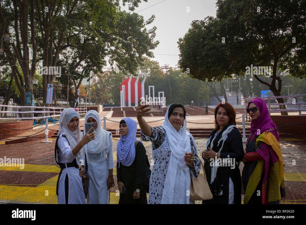 Dhaka, Bangladesh. 20th Feb, 2019.  Bangladeshi people take selfie in front of the language matyrs monument in Dhaka, Bangladesh on February 20, 2019.  The nation will pay tribute to the Bangla language movement martyrs who sacrificed their life for their mother tongue in 1952, while the United Nations Educational Scientific and Cultural Organization (UNESCO) declared 21 February as the International Mother Language Day. Credit: zakir hossain chowdhury zakir/Alamy Live News Stock Photo