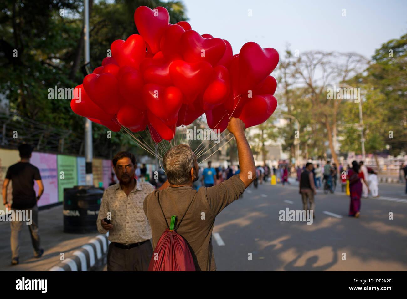 Dhaka, Bangladesh. 20th Feb, 2019.  A hawker sells red balloon in front of the language matyrs monument  in Dhaka, Bangladesh on February 20, 2019.  The nation will pay tribute to the Bangla language movement martyrs who sacrificed their life for their mother tongue in 1952, while the United Nations Educational Scientific and Cultural Organization (UNESCO) declared 21 February as the International Mother Language Day. Credit: zakir hossain chowdhury zakir/Alamy Live News Stock Photo