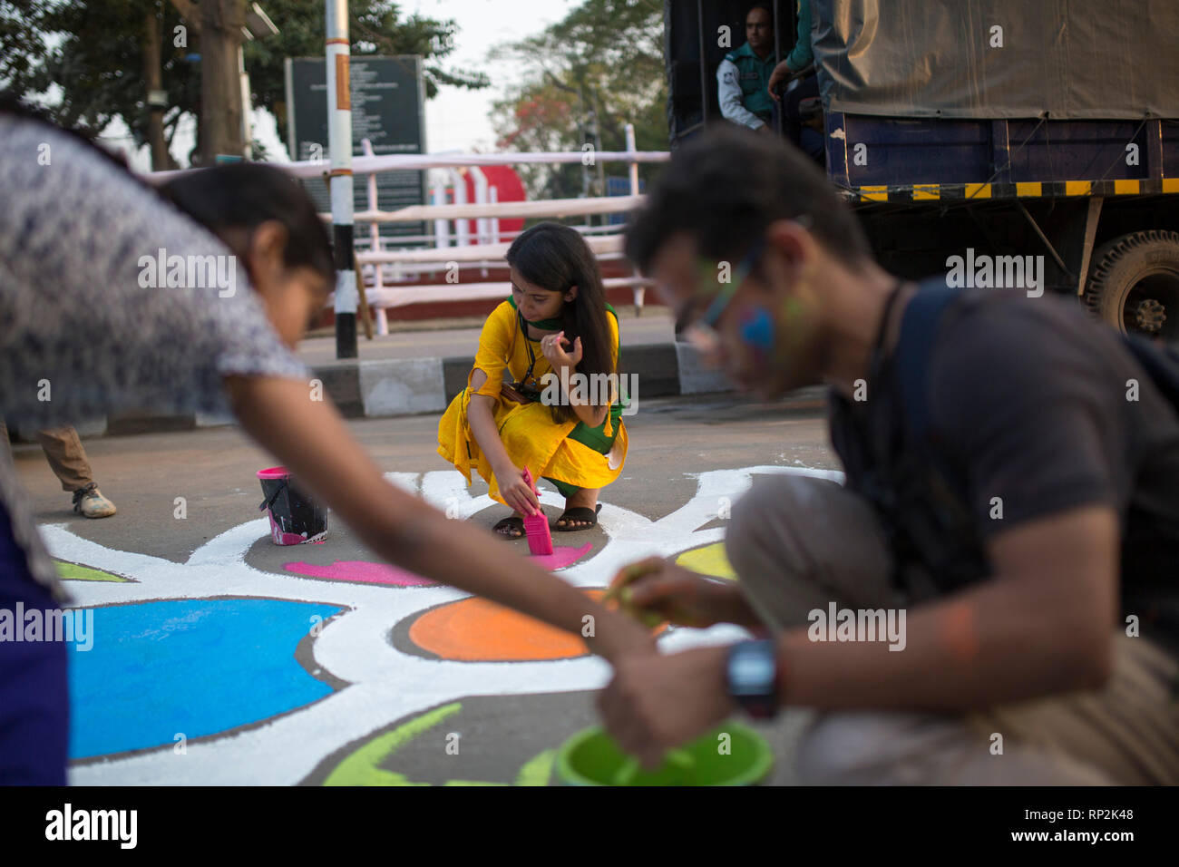 Dhaka, Bangladesh. 20th Feb, 2019.  Bangladeshi students paints on the street as part of the decoration for the International Mother Language Day celebration in front of the language matyrs monument  in Dhaka, Bangladesh on February 20, 2019.  The nation will pay tribute to the Bangla language movement martyrs who sacrificed their life for their mother tongue in 1952, while the United Nations Educational Scientific and Cultural Organization (UNESCO) declared 21 February as the International Mother Language Day. Credit: zakir hossain chowdhury zakir/Alamy Live N Stock Photo