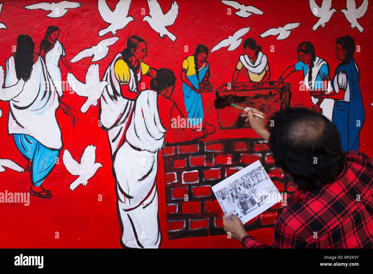 Dhaka, Bangladesh. 20th Feb, 2019.  Bangladeshi students paints on the wall as part of the decoration for the International Mother Language Day celebration in front of the language matyrs monument  in Dhaka, Bangladesh on February 20, 2019.  The nation will pay tribute to the Bangla language movement martyrs who sacrificed their life for their mother tongue in 1952, while the United Nations Educational Scientific and Cultural Organization (UNESCO) declared 21 February as the International Mother Language Day. Credit: zakir hossain chowdhury zakir/Alamy Live New Stock Photo