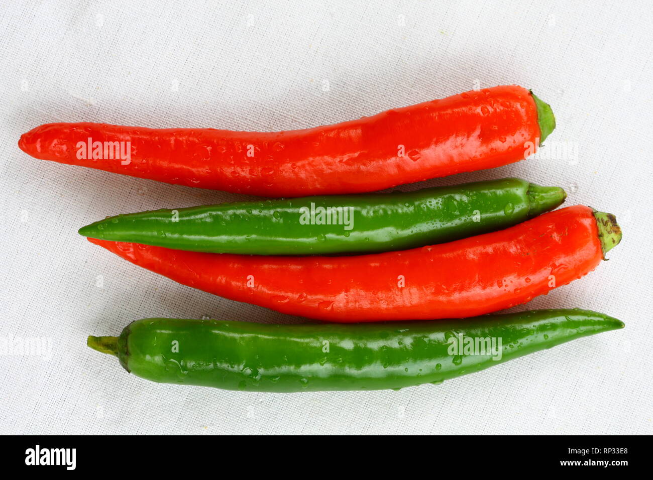 Red and green Thai chili peppers Stock Photo