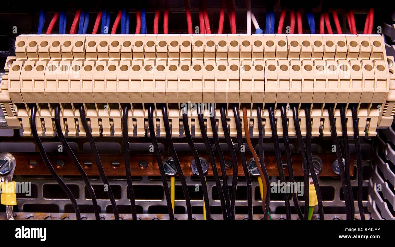 Terminal blocks for electrical connection and earthing terminals for grounding in the control cubicle. Close up. Stock Photo