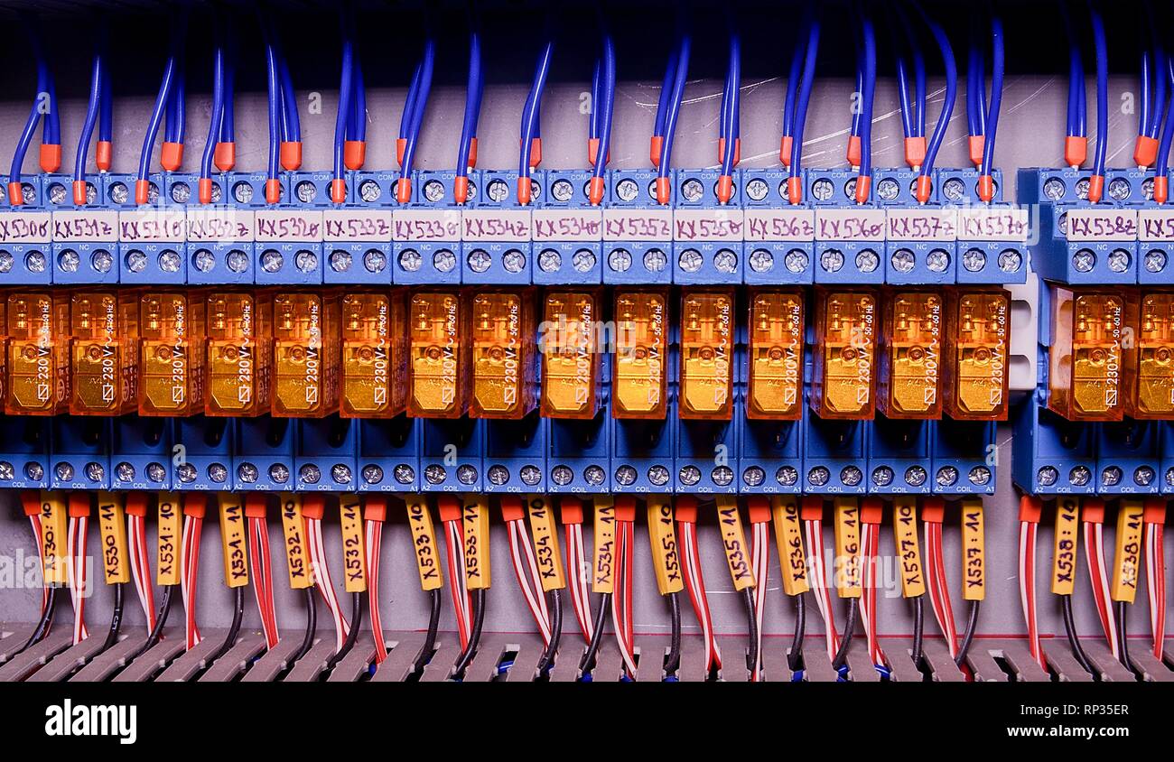 Relay actuators inside the industrial power case. Close up. Stock Photo
