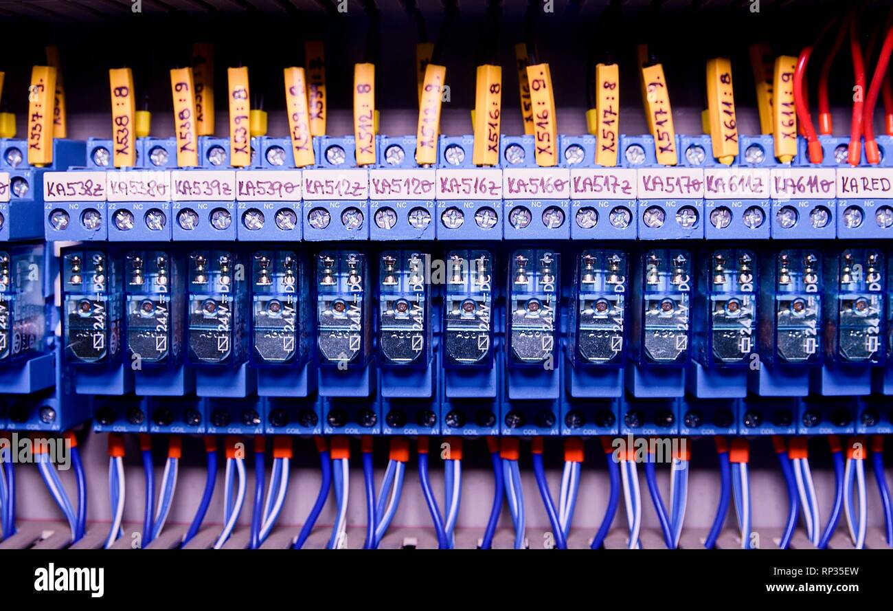 Relay actuators inside the industrial power case. Close up. Stock Photo