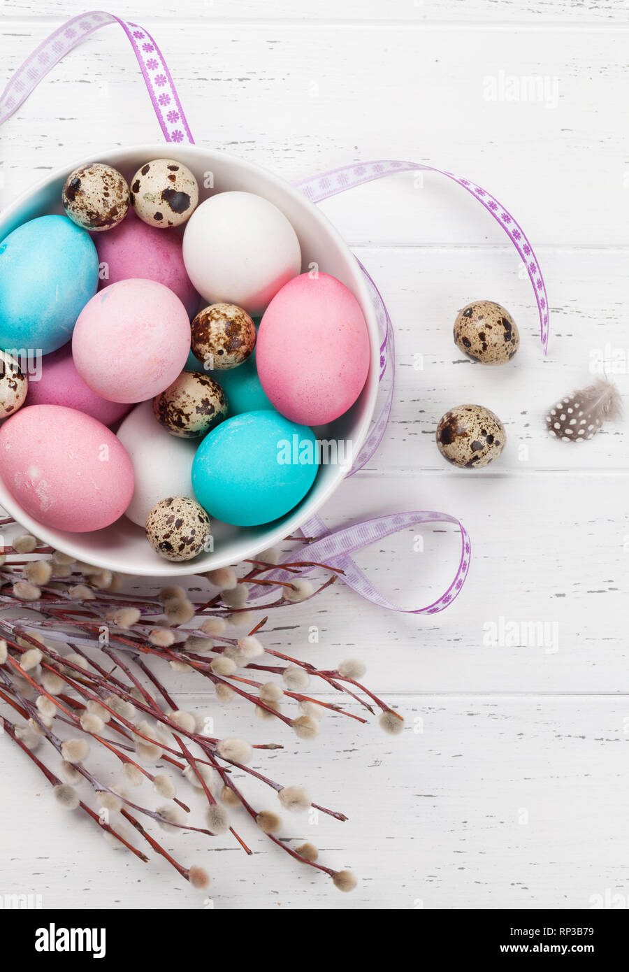 Easter greeting card with colorful easter eggs in bowl on wooden table ...