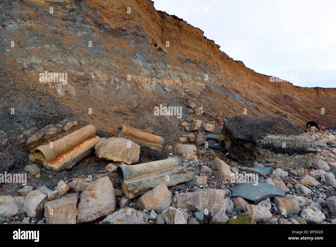 Coastal, Erosion, debris, on the, beach, pipes, cracks, cliffs, lower, greensand, wealden, beds, geology, Compton, Bay, Isle of Wight, UK, Stock Photo