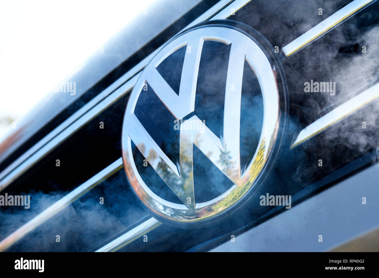 VW signs on a car and exhaust gas, symbolic photo diesel scandal, VW-Zeichen auf einem Auto und Autoabgase, Symbolfoto Dieselskandal Stock Photo