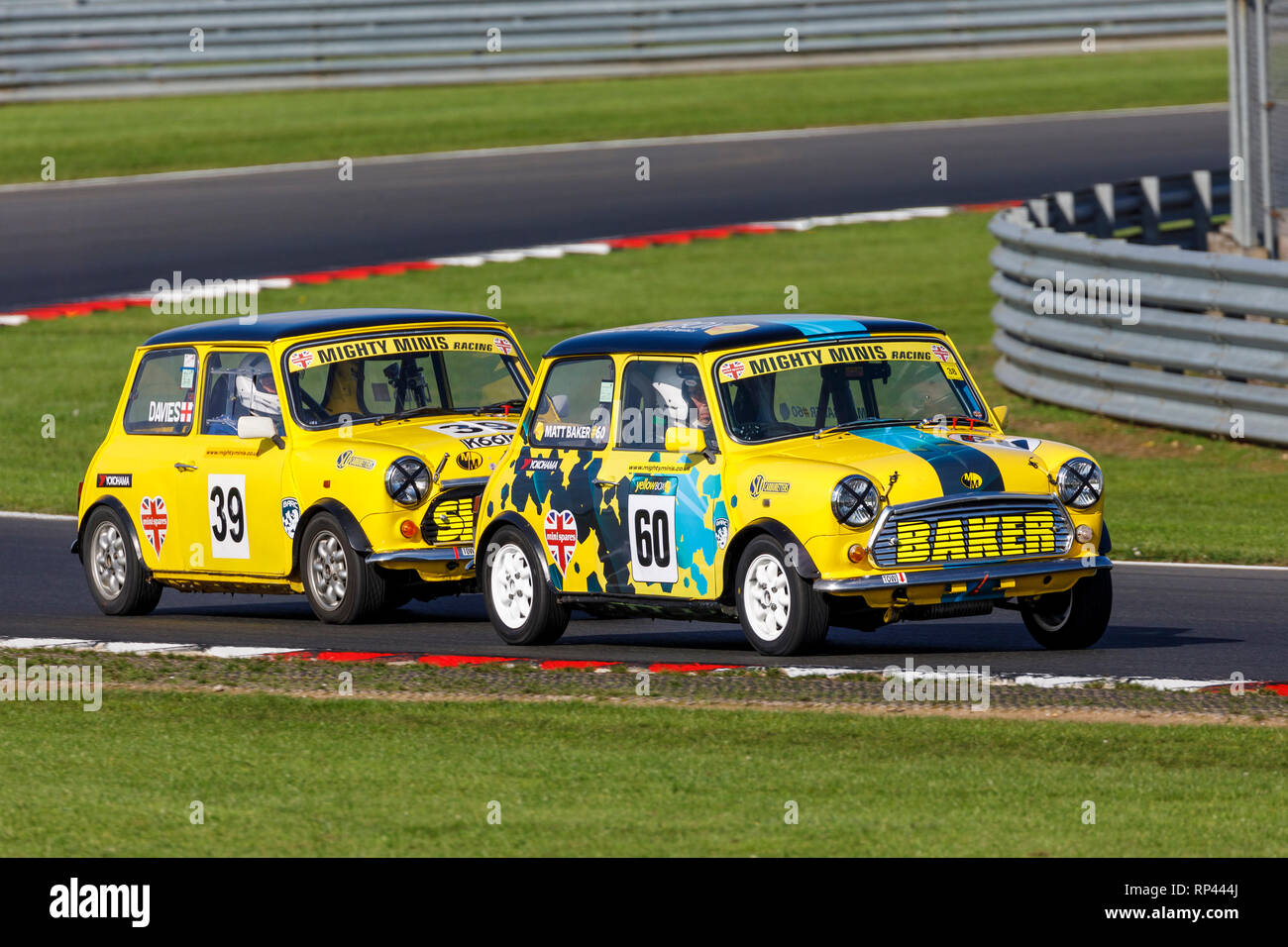 Matthew Baker and Mark Davies battle it out in the Mighty Minis Championship race at Snetterton 2018, Norfolk, UK. Stock Photo