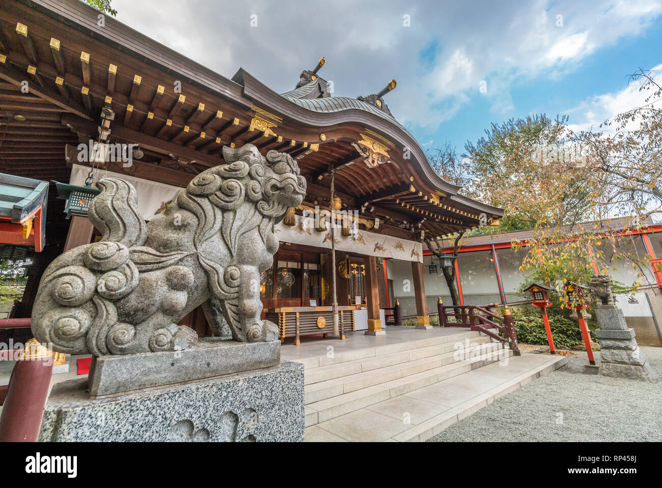 Exterior of Suzukamyo Jinja shinto Shrine, Main Hall and Komainu (LionDog) Guardian. Located in