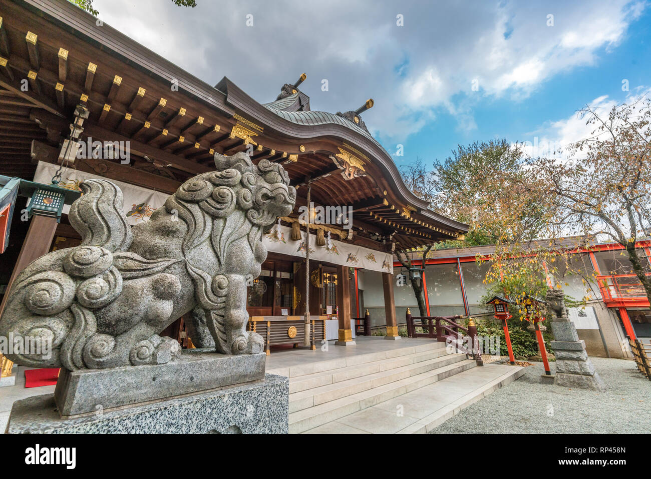 Exterior of Suzukamyo Jinja shinto Shrine, Main Hall and Komainu (LionDog) Guardian. Located in