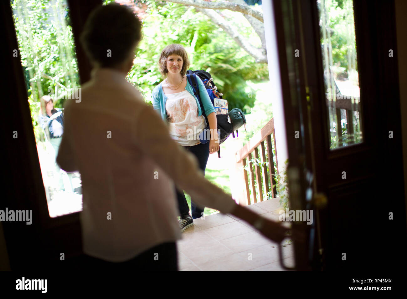 Two families greeting door hi-res stock photography and images - Alamy