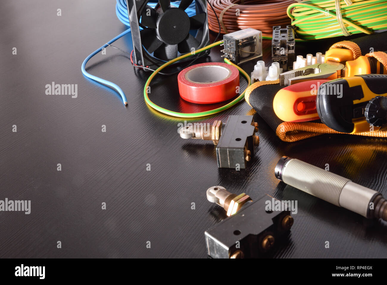 Maintenance Electrical Table Black table with industrial equipment and tools for installation ...