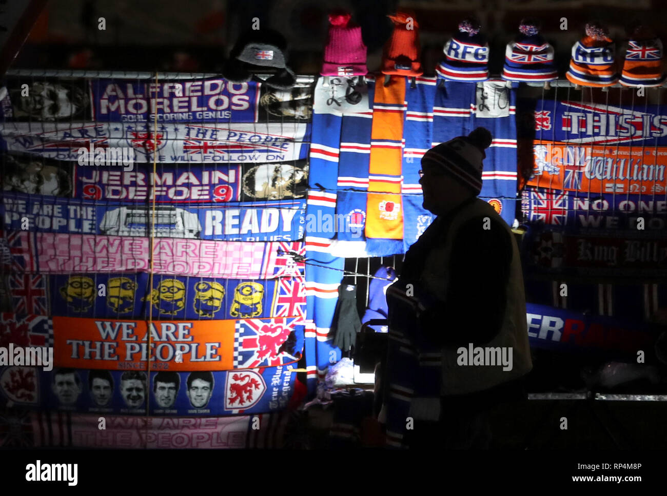 football scarves on a merchandise stall outside the stadium ahead of the William Hill Scottish Cup fifth round replay match at Ibrox Stadium, Glasgow. Stock Photo