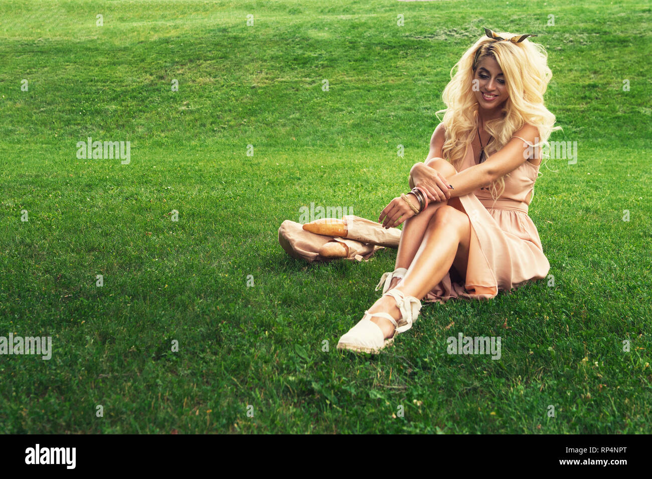 eauty blonde alone young woman resting in the park Stock Photo