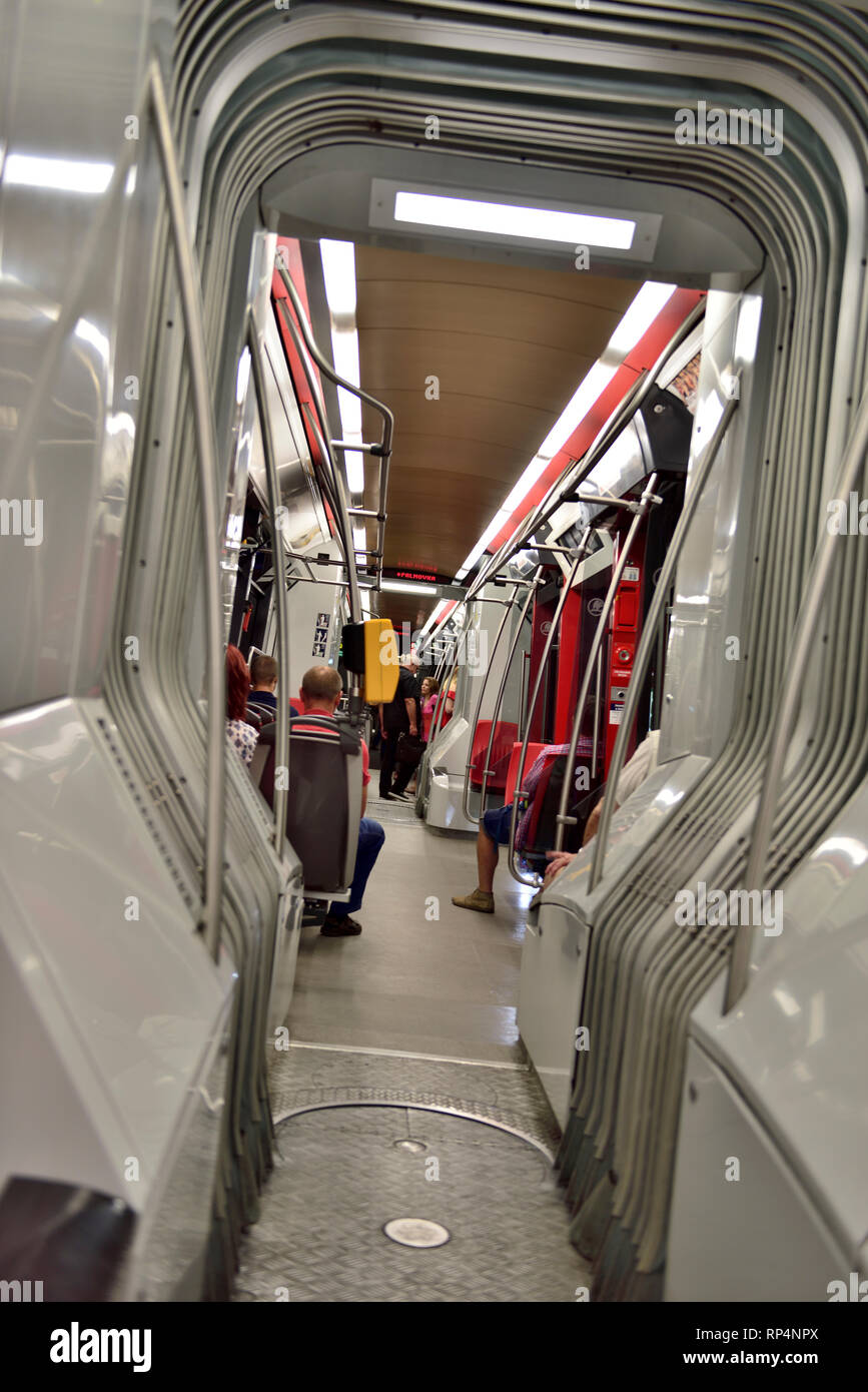 Inside modern rapid transport articulated tram with the pivot joint between cars showing, Prague, Europe Stock Photo
