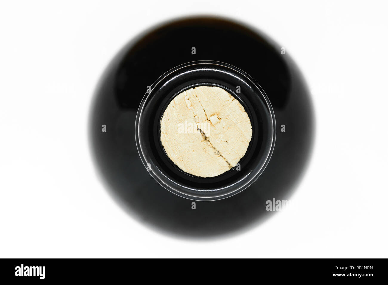 Closed with cork black glass wine bottle view from top on white background  Stock Photo - Alamy