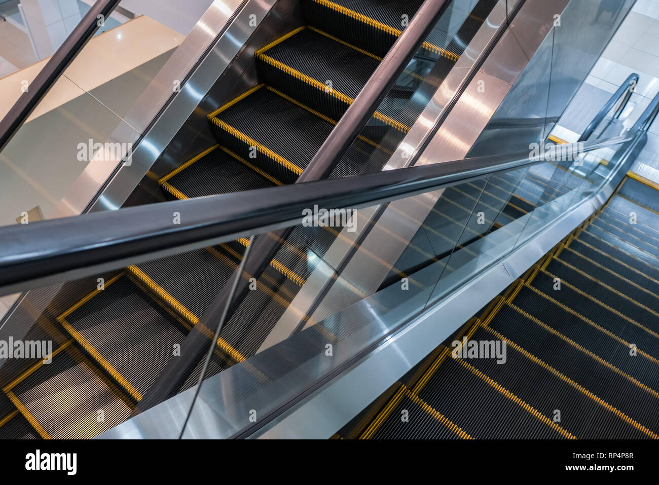 Escalators in shopping mall Stock Photo