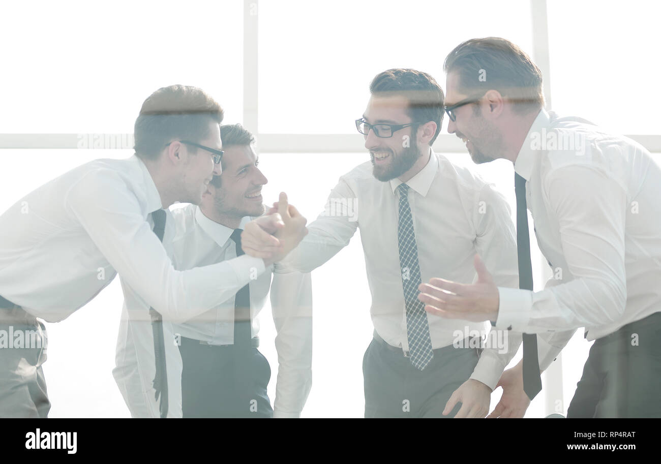 happy employees giving each other a high five Stock Photo - Alamy