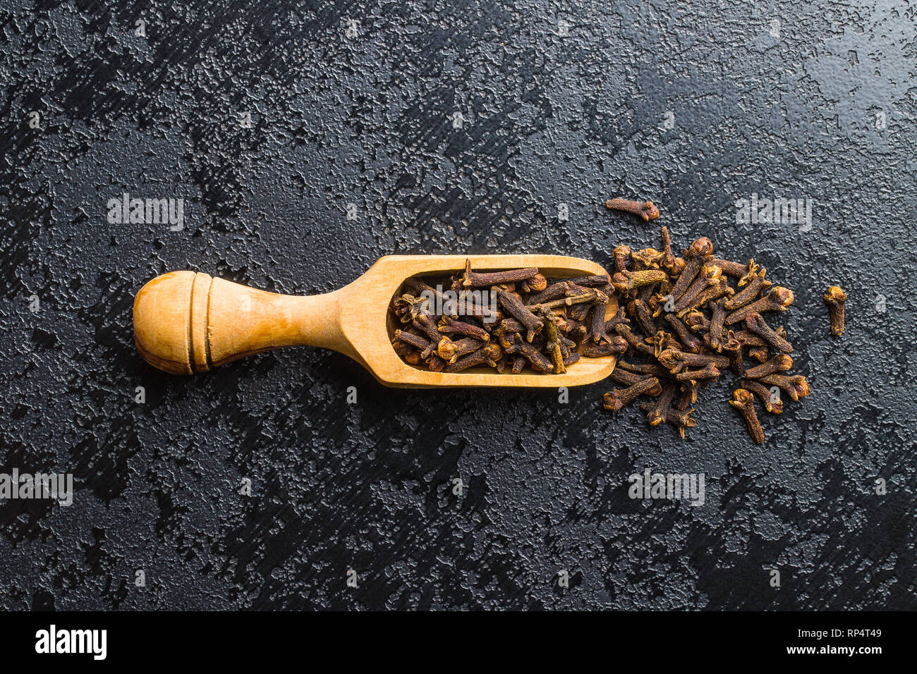 Carnation, dried clove spice in scoop. Stock Photo