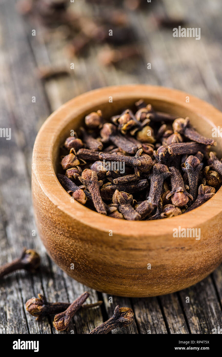 Carnation, dried clove spice in bowl. Stock Photo