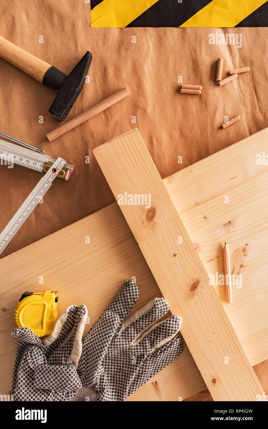 Carpentry woodwork workbench top view with planks and dowels Stock Photo