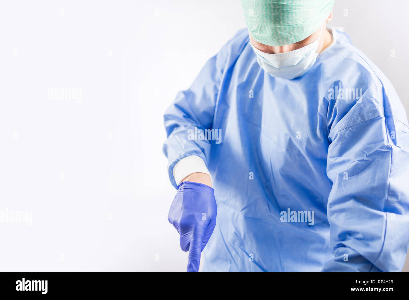 Surgeon Doctor In Sterile Gloves Preparing For Operation In Hospital