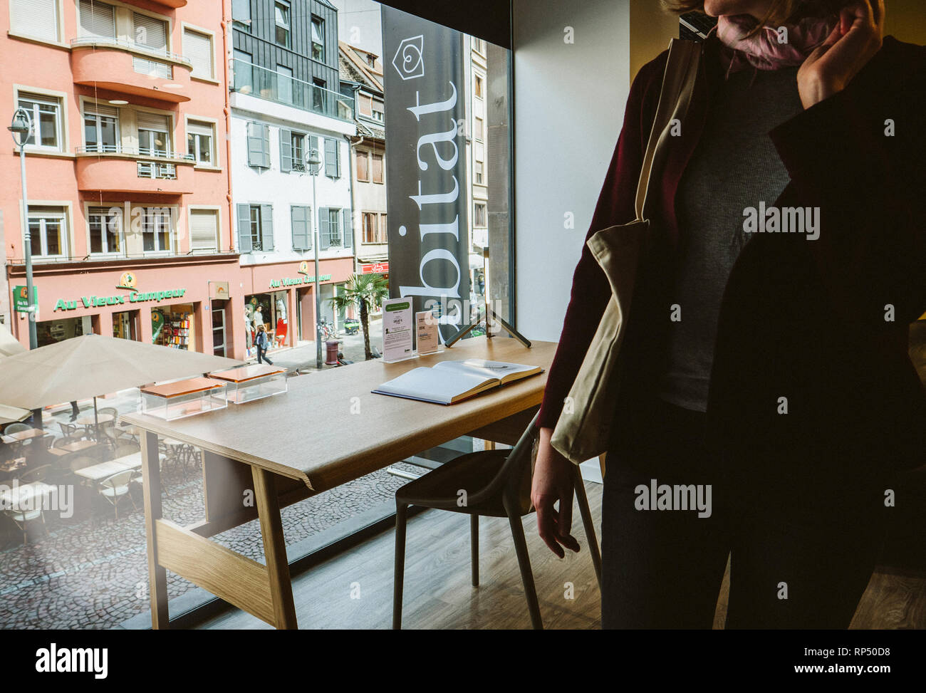 STRASBOURG, FRANCE SEP 2, 2017 Woman buying table office furniture in Habitat store with a