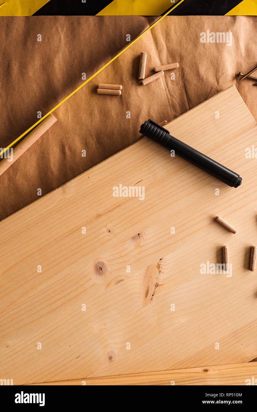 Felt tip pen on woodwork carpentry workshop table with other tools of trade for diy hobby project Stock Photo