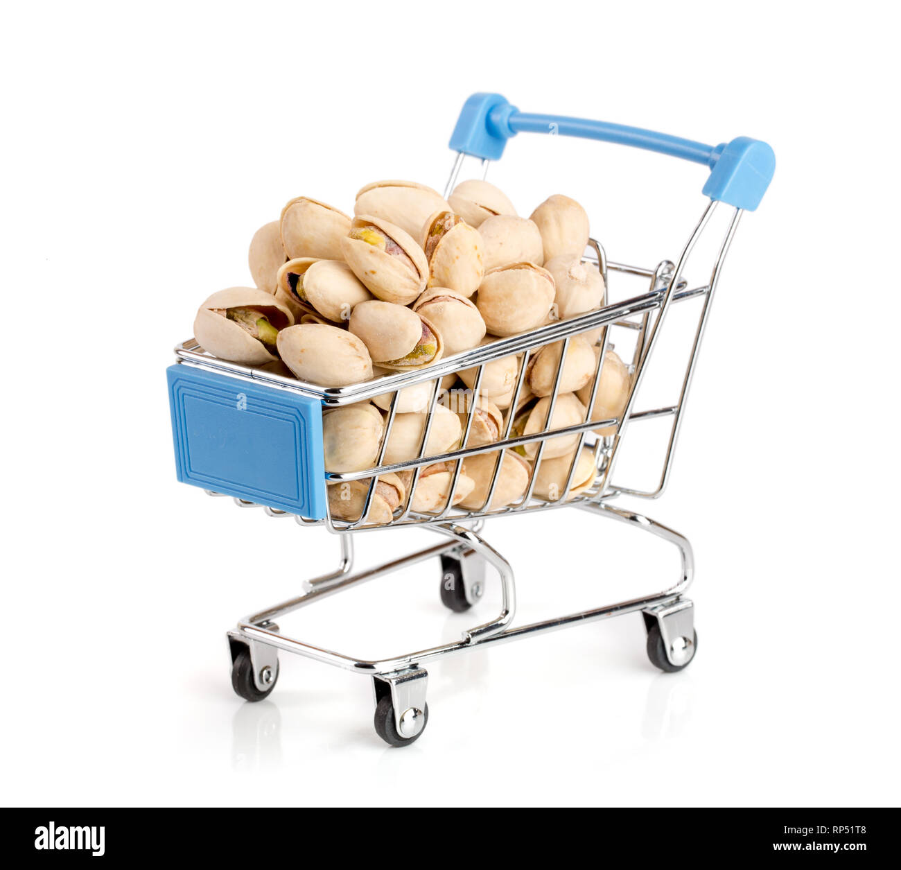 Pistachio in a shopping cart isolated on white background. Stock Photo